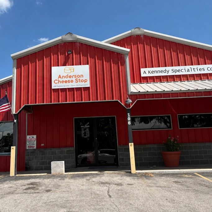 Anderson Cheese Stop red storefront at 106 W Beaver St